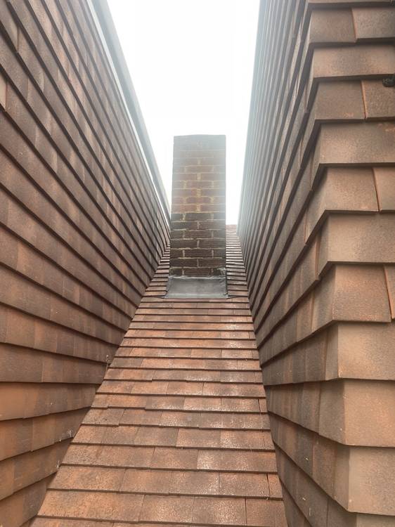 After — new roof tiles and chimney