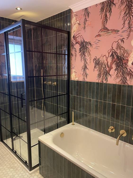 After — master bathroom shower and bath with feature tiles