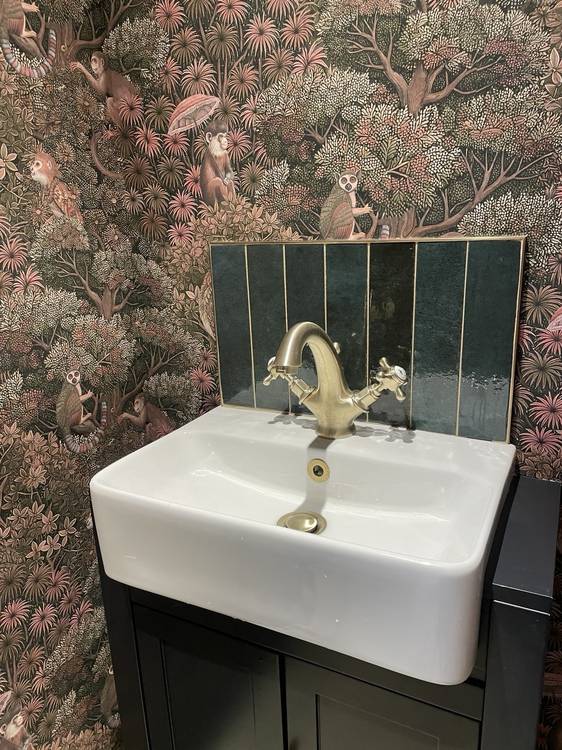 After — cloakroom with feature wallpaper