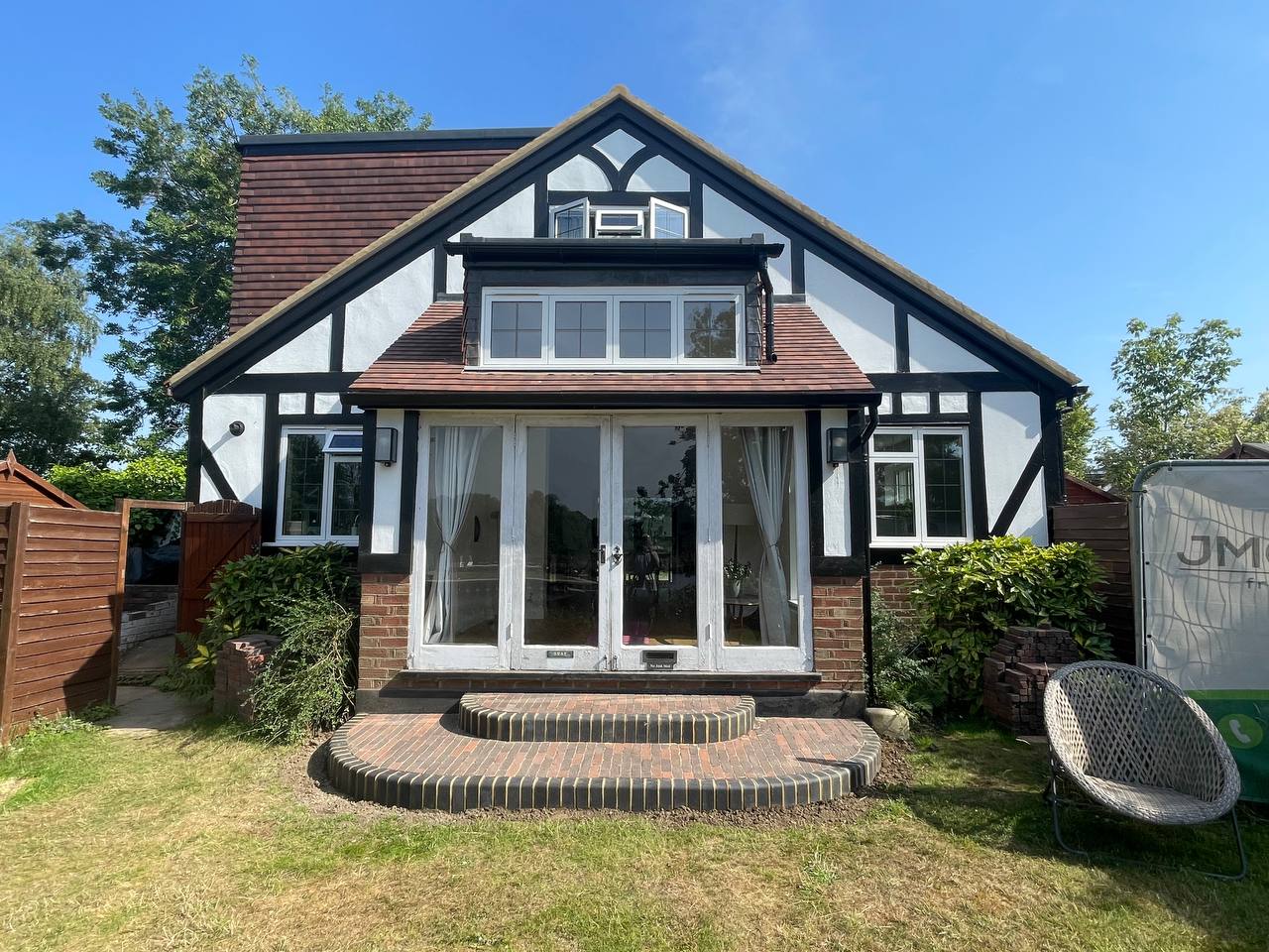 After — rear elevation bifold doors and patio