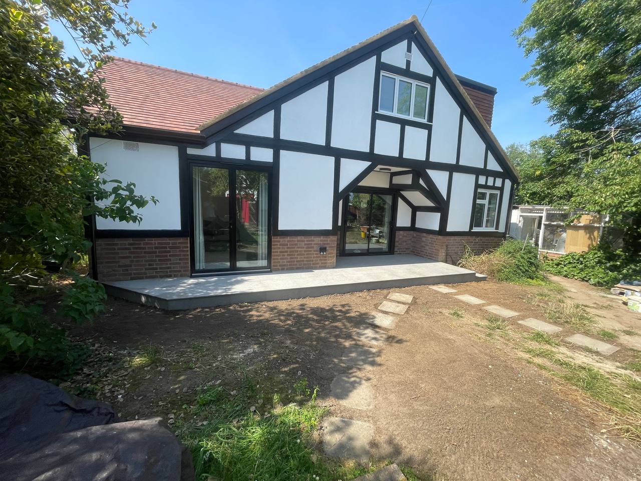 After — rear elevation full view with new patio