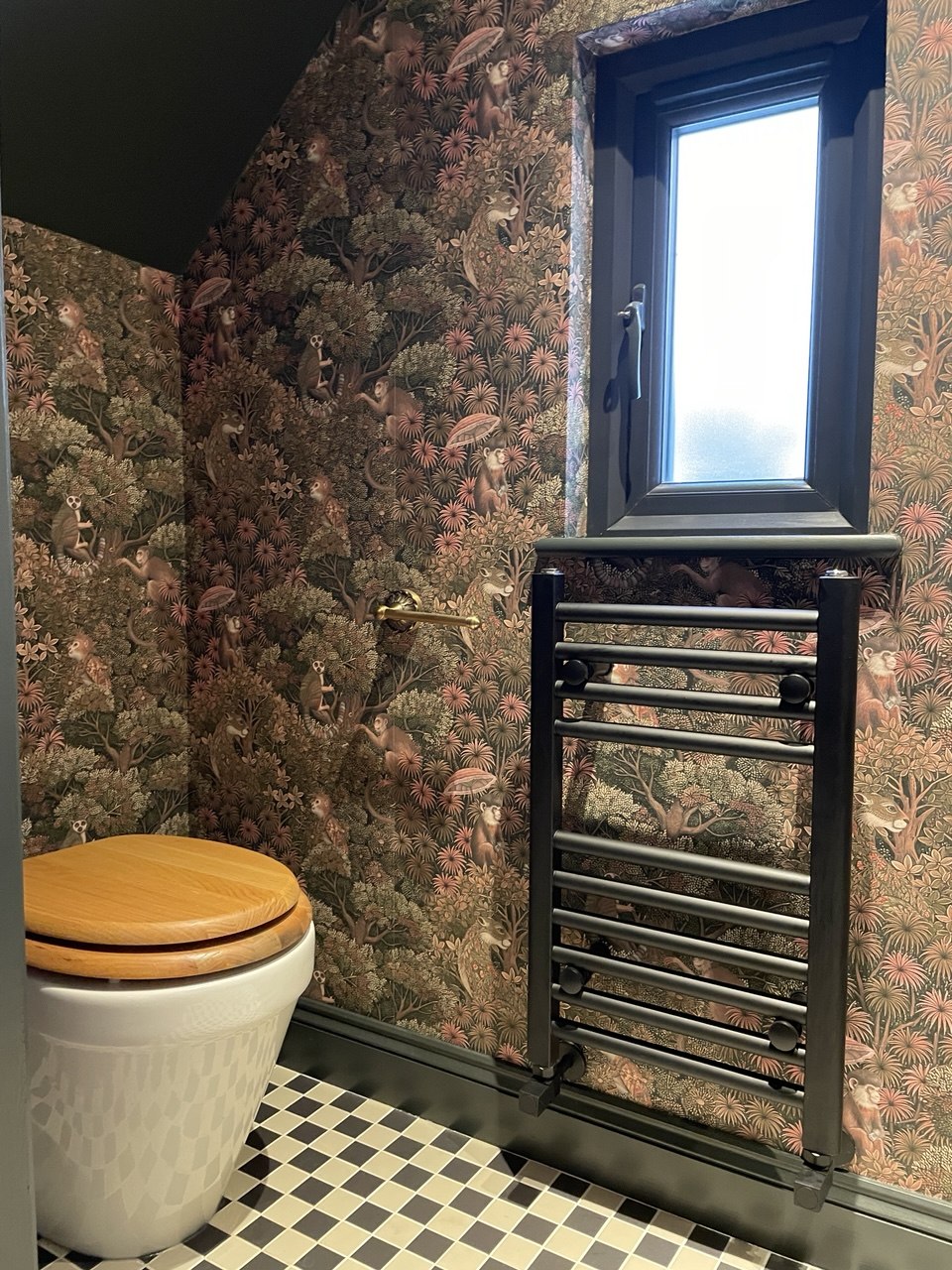 After — cloakroom toilet with feature wallpaper