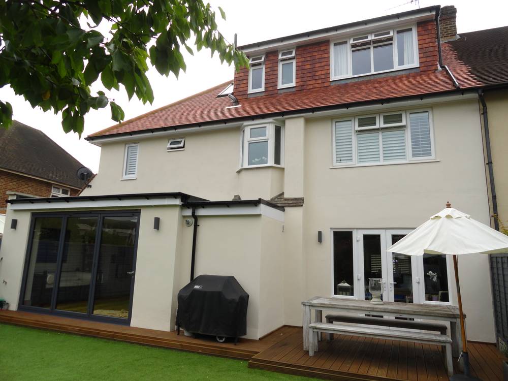 After — completed rear with render and extension