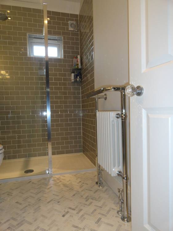 After — shower room with heated towel rail