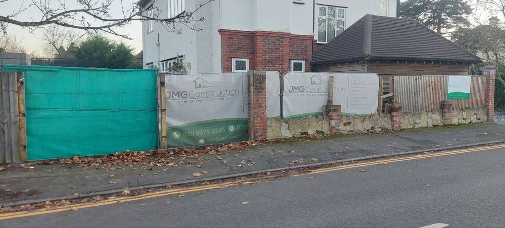 During — JMG hoardings at front