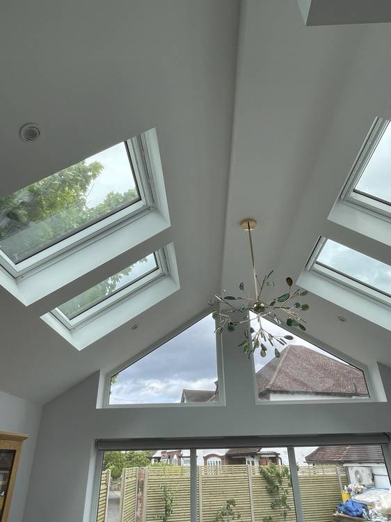 After — vaulted ceiling with Velux skylights and feature pendant