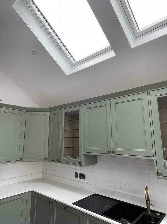 After — sage green shaker kitchen with skylight