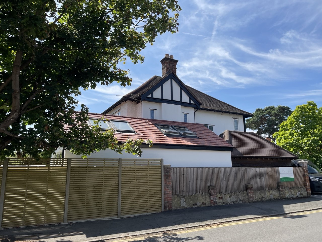 After — street view showing extension roof and rooflights