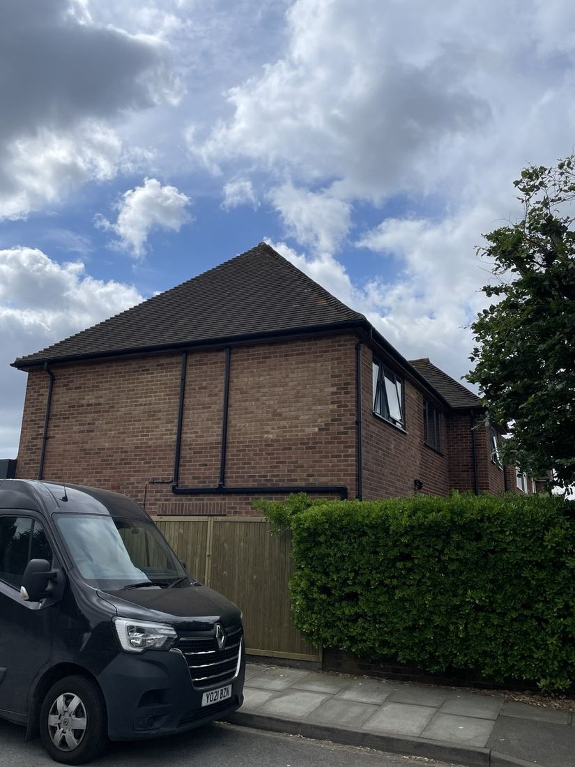 After — front elevation with two storey side extension and van