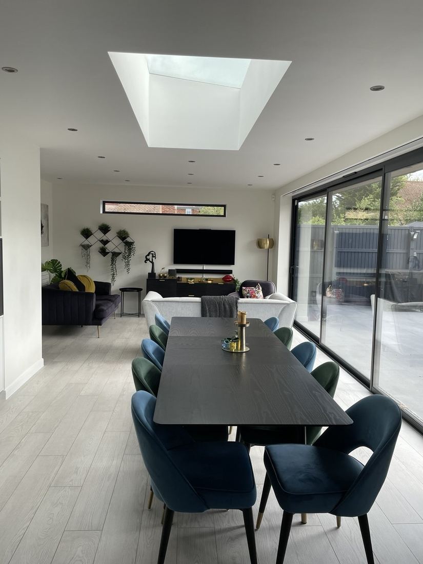 After — open-plan dining and living space with rooflight
