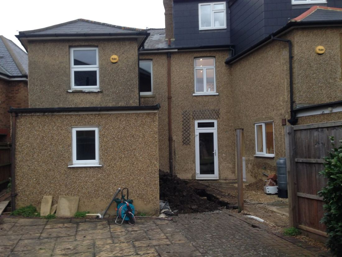Before — rear elevation with original pebbledash render